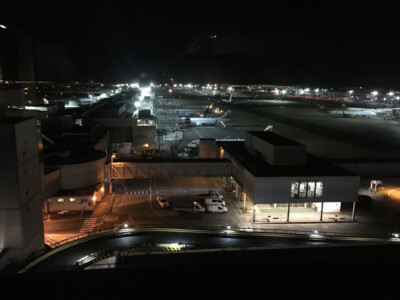 Elevated night view across a lit industrial and retail park